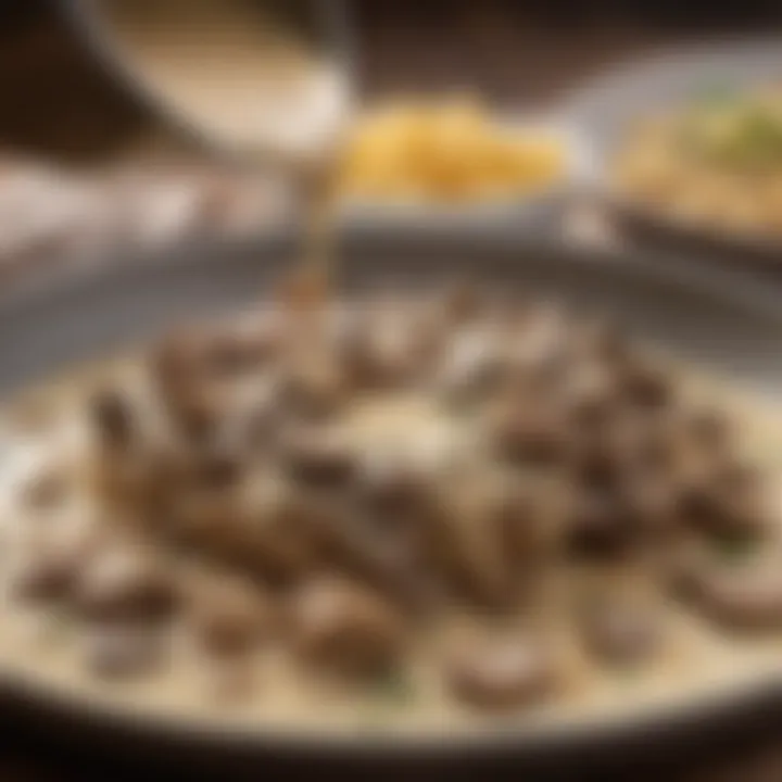 A close-up of the creamy mushroom sauce being poured over perfectly cooked beef