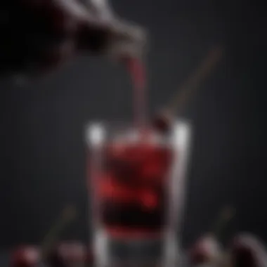 A close-up view of a black cherry cocktail being poured into a stylish glass, illustrating the cocktail's luxurious appeal.