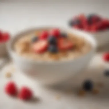 A close-up of a bowl of oatmeal topped with fresh berries and nuts.