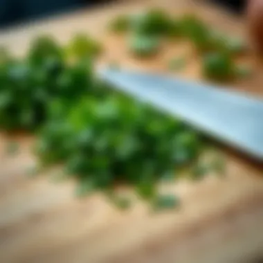 A close-up of cilantro being finely chopped on a cutting board