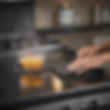 Person applying cleaner on a glass stove top