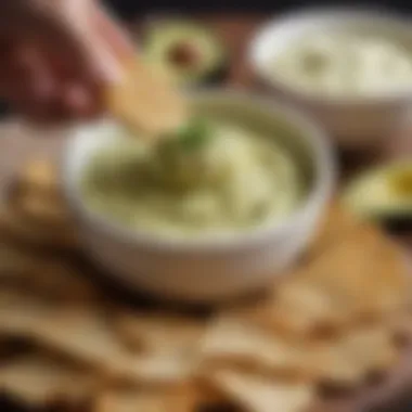 A close-up view of a spoonful of creamy avocado dip, highlighting its rich texture