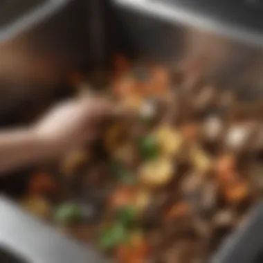 Close-up of compost materials being added to a mountable kitchen compost bin, highlighting sustainable waste management.