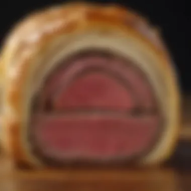 Close-up of the perfectly cooked Beef Wellington showcasing its layers