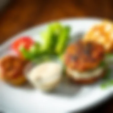 Plated Crabmeat Patty with Dipping Sauce A beautifully plated crabmeat patty with a side of dipping sauce