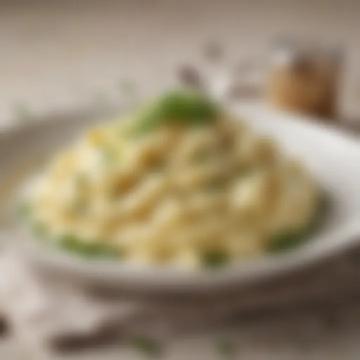 A close-up of creamy mashed potatoes topped with fresh herbs and a drizzle of melted butter.