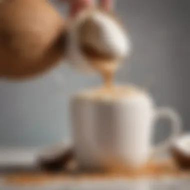 A close-up view of creamy coconut milk being poured into a coffee cup