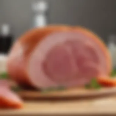 Close-up of a slice of ham with glossy glaze served elegantly