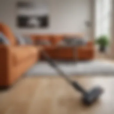 A sleek lightweight cordless stick vacuum in a modern living room setting.