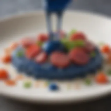 A close-up view of a blue poke sauce drizzle over a gourmet plate, emphasizing its flavor profile