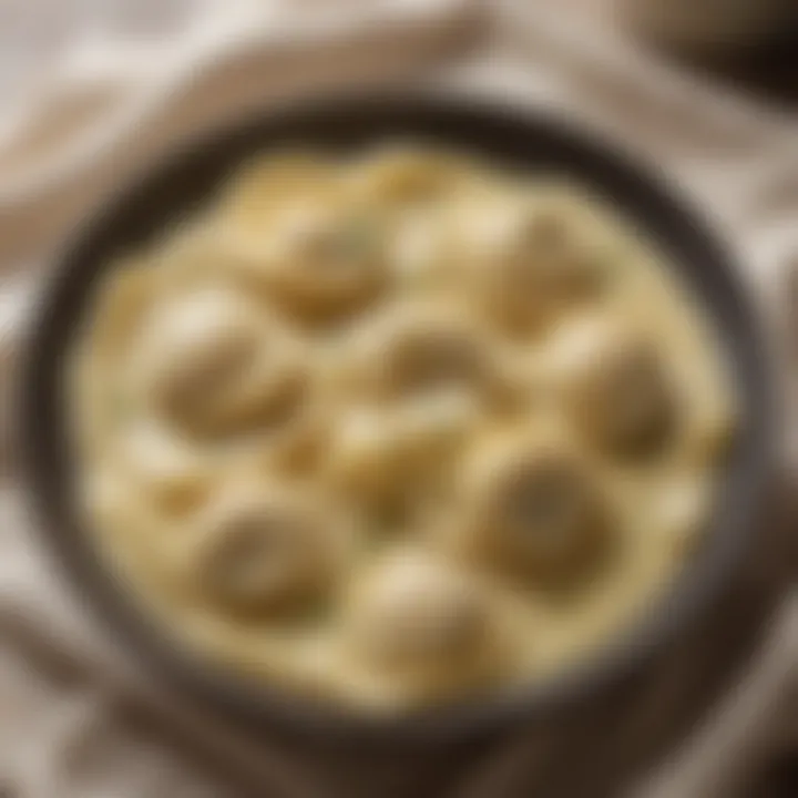 A close-up of the rich and creamy Alfredo sauce enveloping tortellini