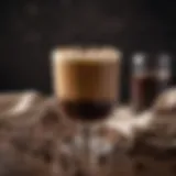 A beautifully arranged coffee cocktail with a frothy top and coffee beans