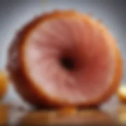 Close-up of a beautifully glazed giant spiral sliced honey ham, showcasing the glossy caramelization.