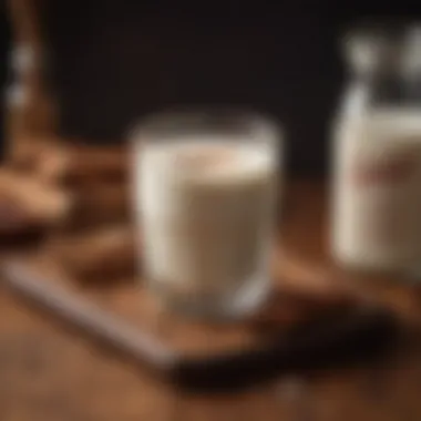 An aesthetically pleasing glass of warm milk with a sprinkle of cinnamon on a wooden table, evoking comfort.