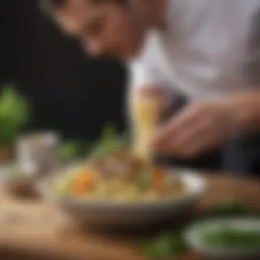 A chef garnishing a modern noodle dish with fresh herbs and spices.