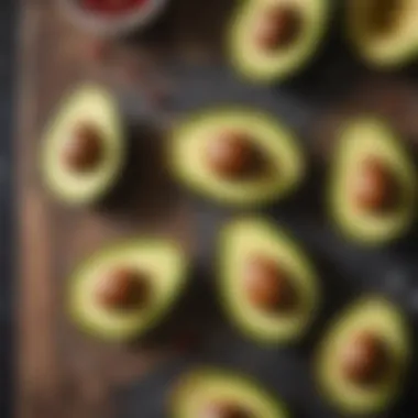 A close-up of avocado slices drizzled with olive oil and sprinkled with sea salt.