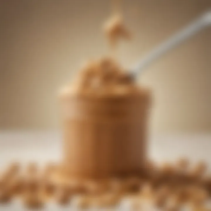 Close-up of a spoonful of creamy peanut butter with peanuts scattered around