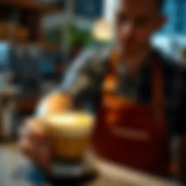 A barista showcasing latte art on a foamy drink