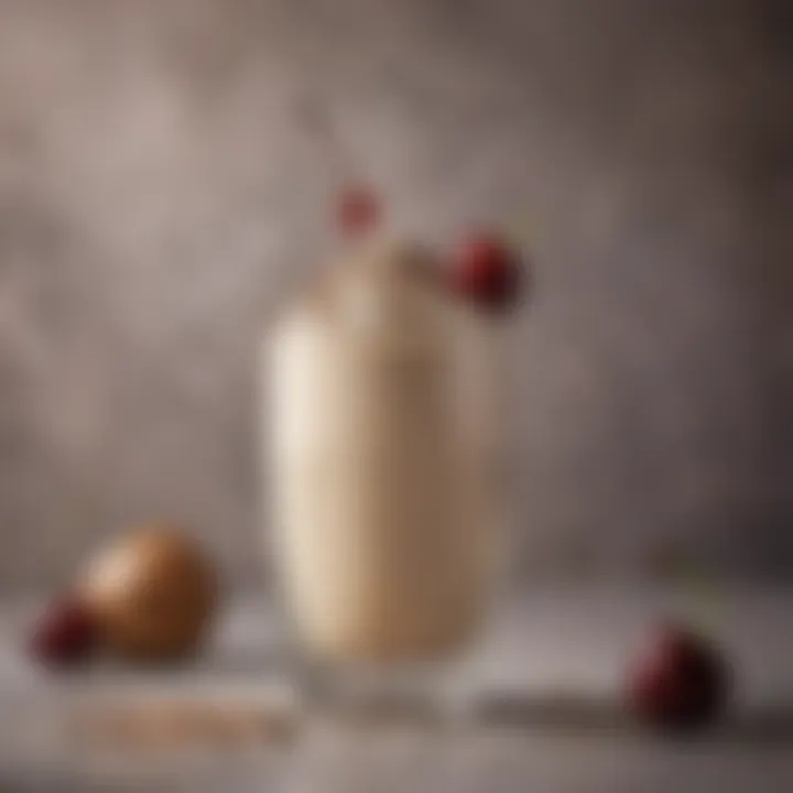 A beautifully garnished Baileys milkshake with a sprinkle of cocoa powder and a cherry on top