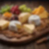 A selection of artisanal cheeses arranged on a wooden board with fruits and nuts.