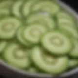 Fresh cucumber slices arranged in a bowl, showcasing their hydrating properties.