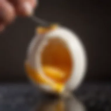 Close-up shot of an egg being peeled, revealing its smooth texture