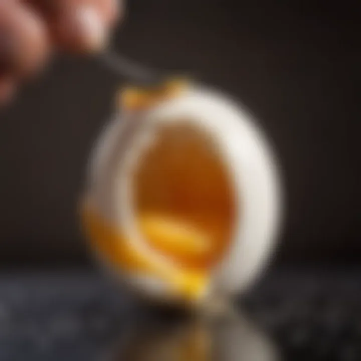 Close-up shot of an egg being peeled, revealing its smooth texture