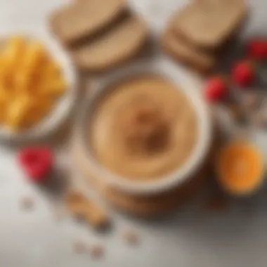 A bowl filled with honey peanut butter surrounded by fresh fruits and whole grain bread.