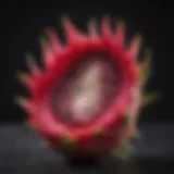 Vibrant dragon fruit cut open revealing its striking flesh