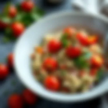 A bowl of quinoa salad topped with fresh herbs and cherry tomatoes