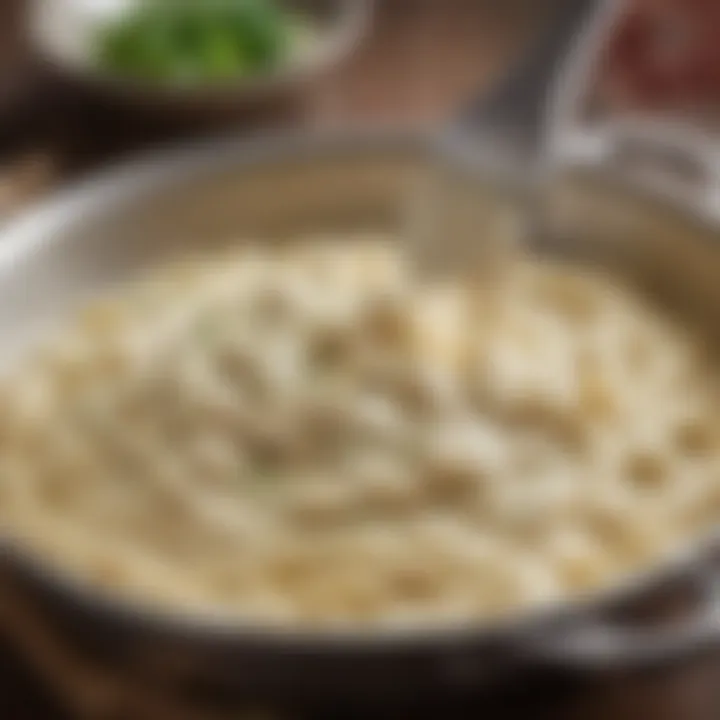 A close-up of creamy Alfredo sauce in a pan