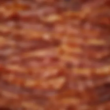 A frying pan with bacon cooked to various textures