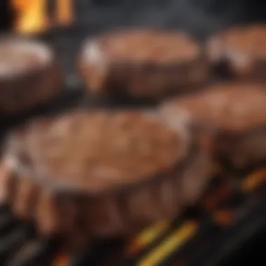 Sizzling Ribeye Steaks on Charcoal Grill Charcoal grill with ribeye steaks sizzling