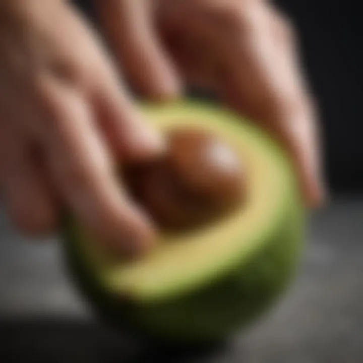 Close-up of an avocado skin being carefully peeled away to reveal the flesh.