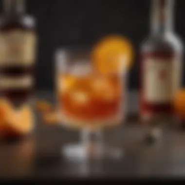 An elegant cocktail glass filled with an old fashioned cocktail, adorned with a twist of orange peel.