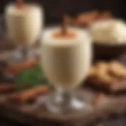 A rich and creamy bowl of eggnog garnished with nutmeg and cinnamon sticks.