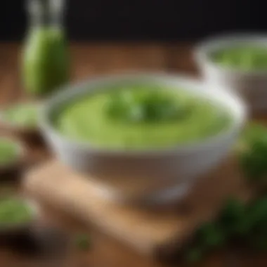 Vibrant green pea puree in a bowl garnished with fresh herbs