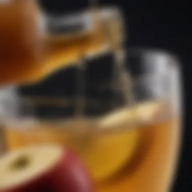 Close-up of apple cider vinegar being poured into a glass