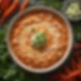 A vibrant bowl of Red Hots Buffalo Chicken Dip garnished with fresh herbs