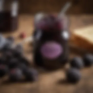 A jar of Smucker's Black Raspberry Jam on a rustic wooden table