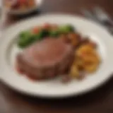 A beautifully plated steak with sides showcasing the culinary artistry in Florence, AL.