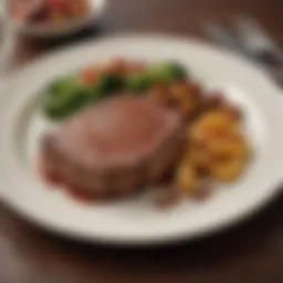 A beautifully plated steak with sides showcasing the culinary artistry in Florence, AL.