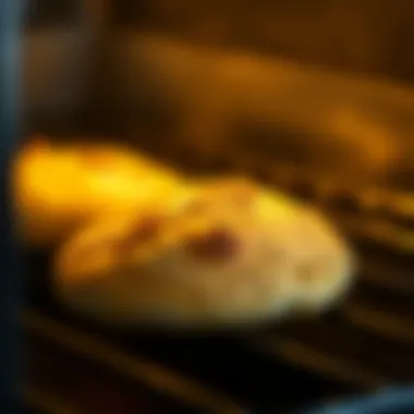 Golden brown pita bread emerging from the oven