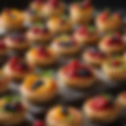 A beautifully arranged assortment of puff pastry tarts filled with fresh fruits and vibrant colors.