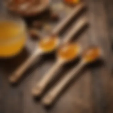 Elegant wooden spoons with honey, placed on a rustic table.