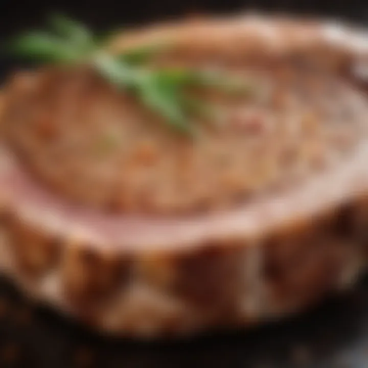 Close-up of a marinated pork chop with seasoning