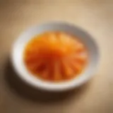 Vibrant orange jelly sticks arranged elegantly on a plate