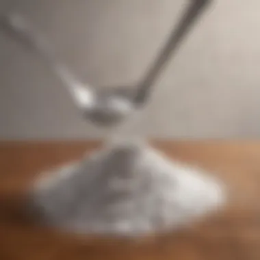 A pile of baking soda with a spoon beside it