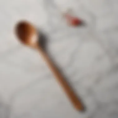 Elegant flat edge wooden spoon on a marble countertop