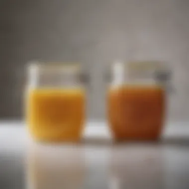 A side-by-side comparison of chicken broth and stock in clear jars